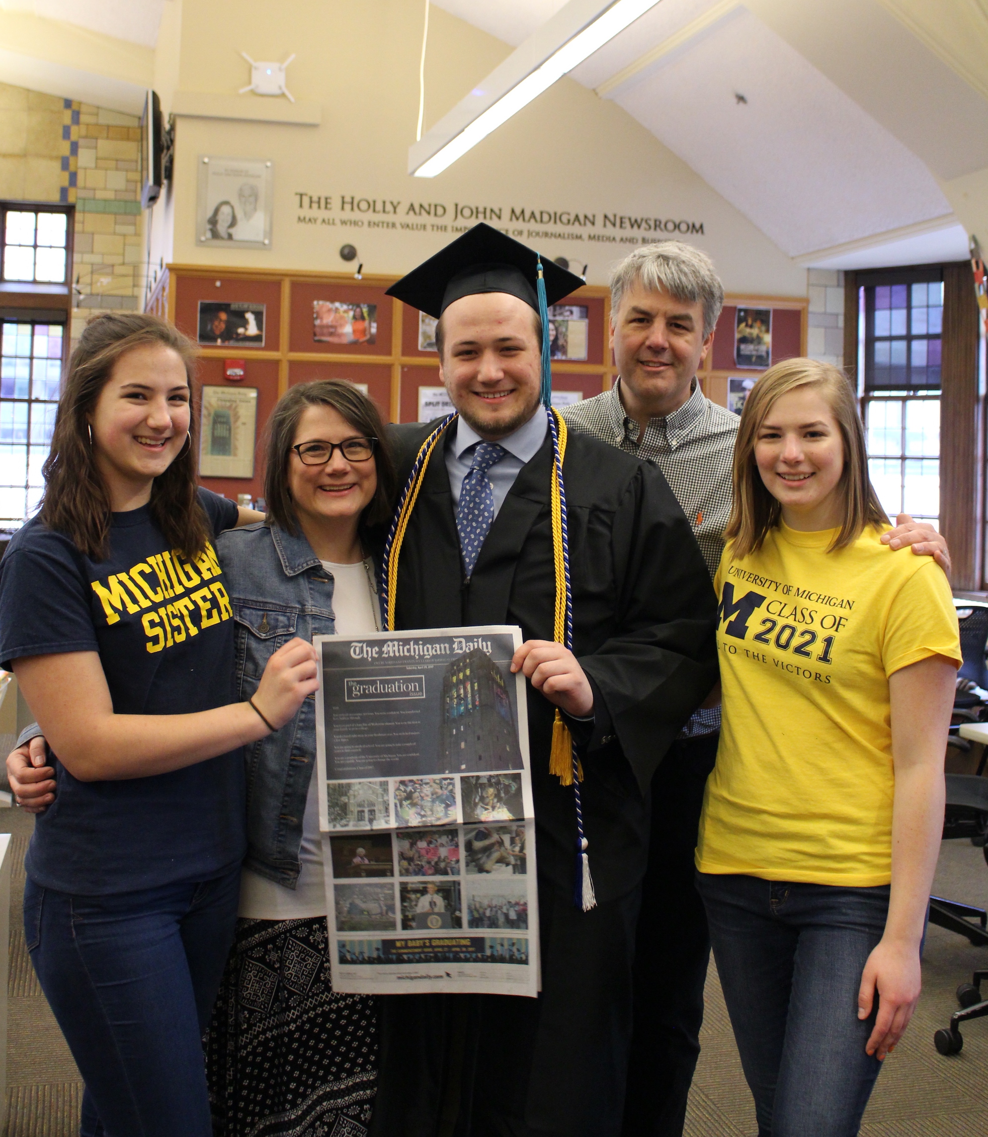 The Michigan Daily sports co-editor Max Bultman and his family celebrate his graduation